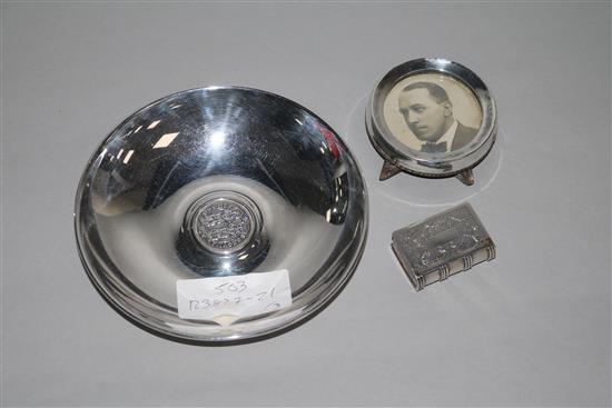 A Chinese white metal snuff box modelled as a book, a silver mounted photograph frame and an 800 silver bowl.